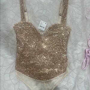 Free people gold bodysuit.  Was slightly big on me so I never wore it
